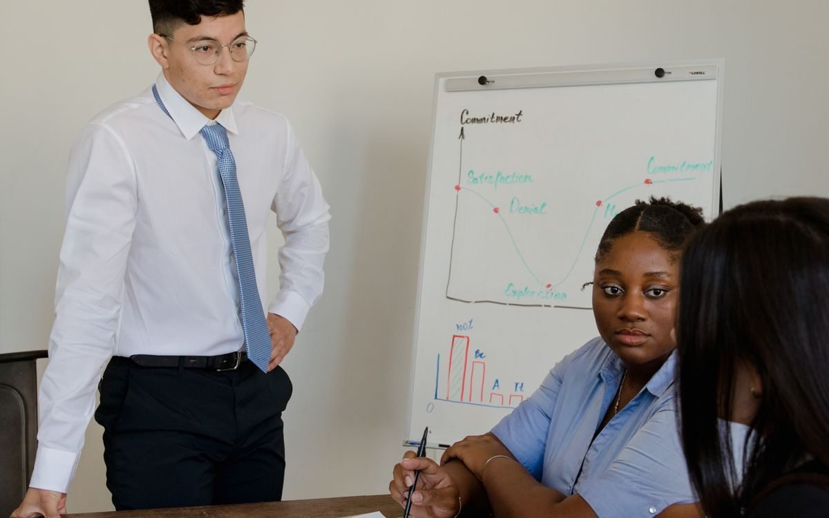 Colleagues reviewing project plans together at a desk
